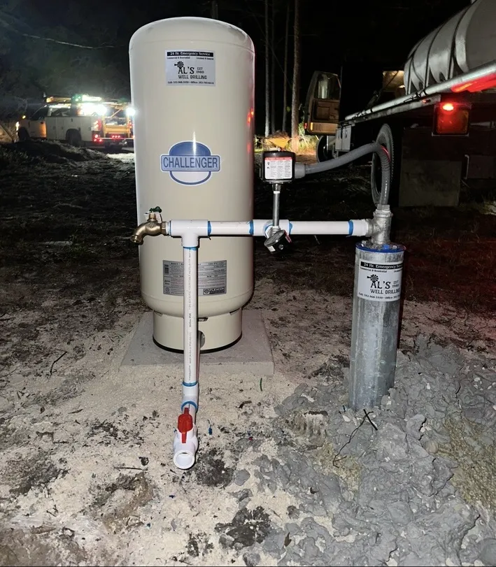 New pressure tank and well system installed at night
