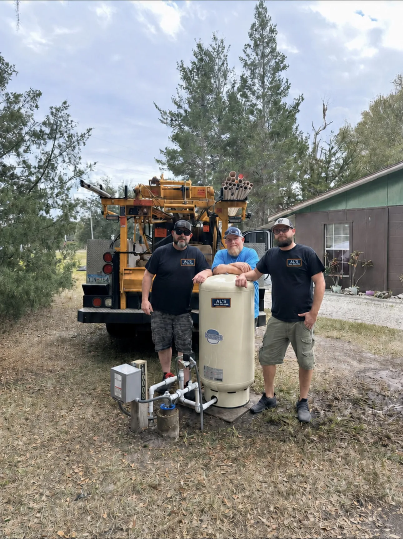 AL’s team beside a completed pressure system installation